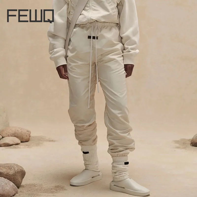 Мужские брюки FEWQ с двойной нитью Новый однотонный дизайн с завязками 2023 Новый Корейский модный тренд Мужские брюки Повседневные 24X1722 Изображение 0
